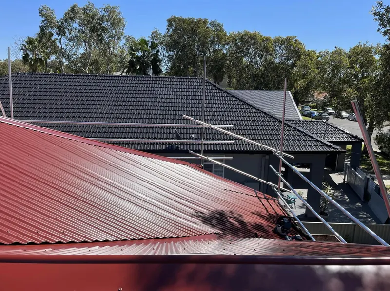 Botany roof repair: new red metal roof sheets