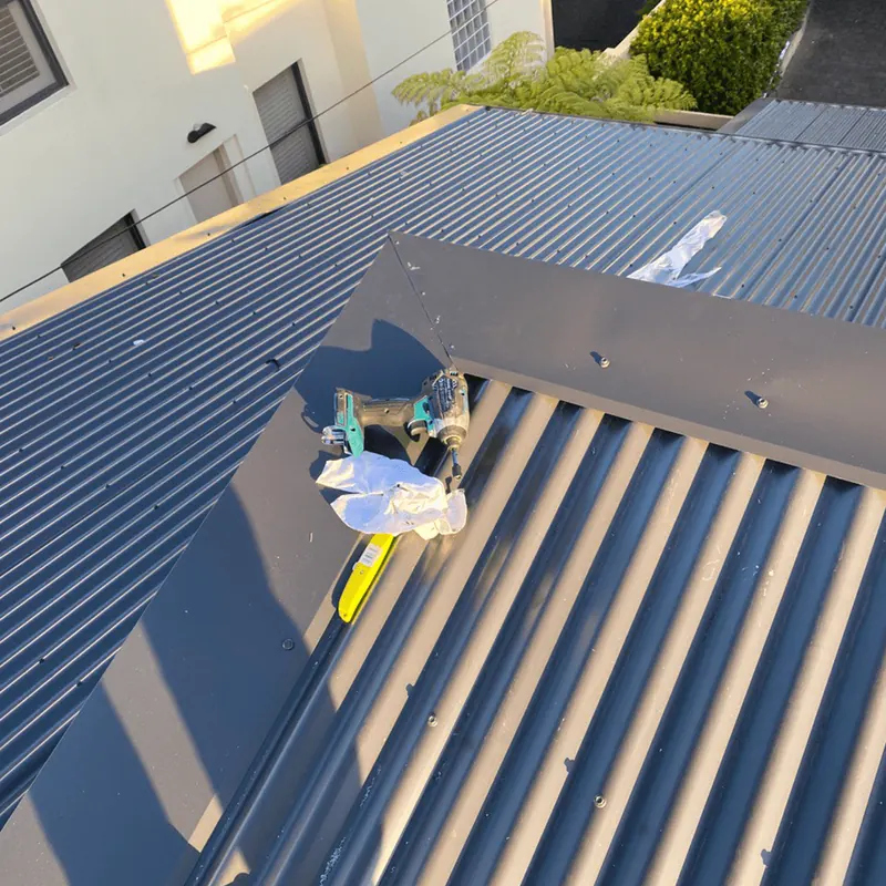 Colorbond sheet being fixed into place
