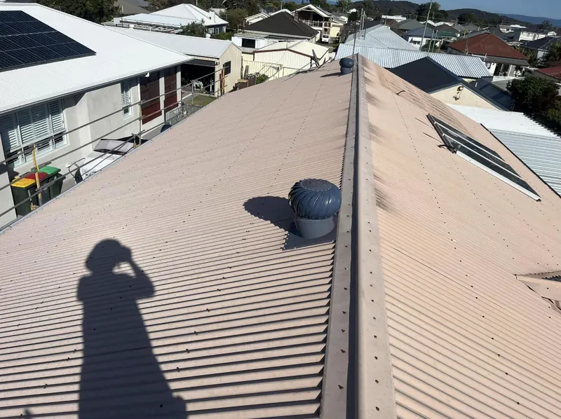 Corrugated metal roof with new ridge vent