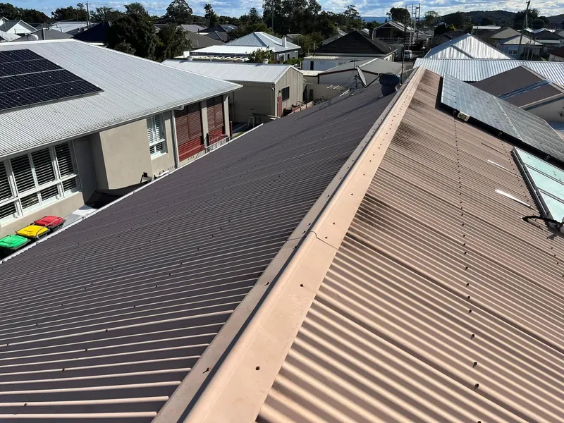 Finished Colorbond roof with ridge capping and solar panels