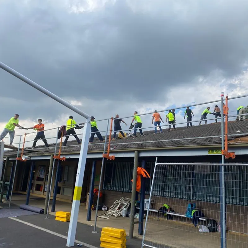Roofing crew working on a commercial roof