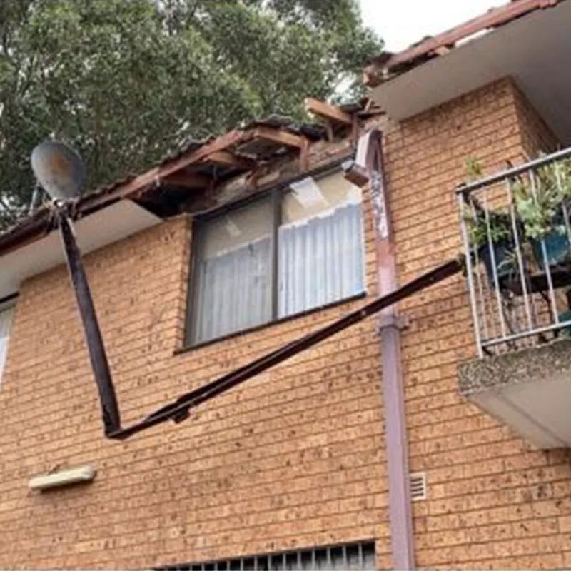 Old gutter and downpipe before replacement