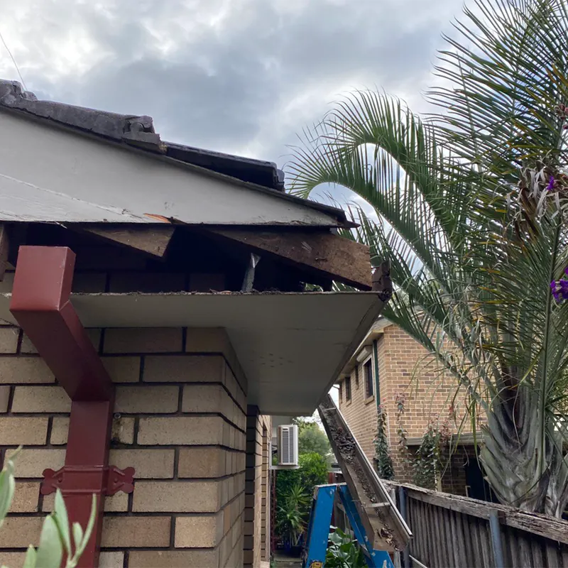New downpipe and gutter on a brick home