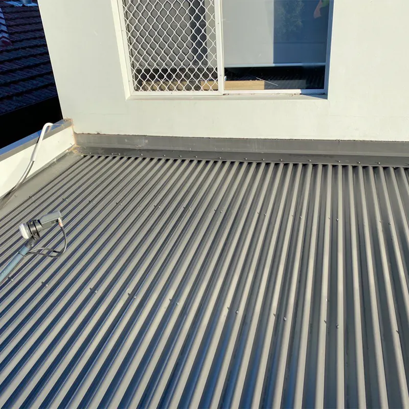 New metal roof over a rear extension