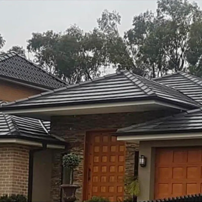 Home with a restored dark tile roof