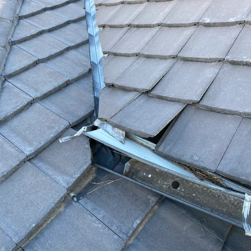 Tile roof valley opened up for repair
